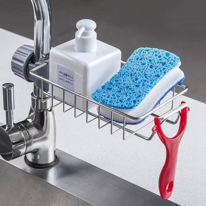 Sink organizer holding a sponge beside a faucet