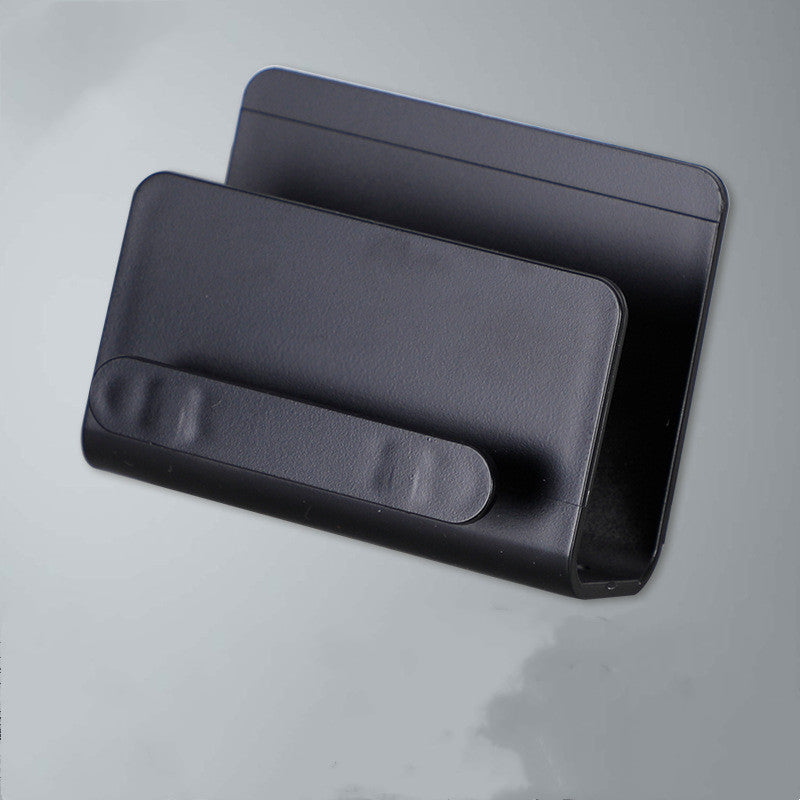 Compact adhesive wall shelf in black